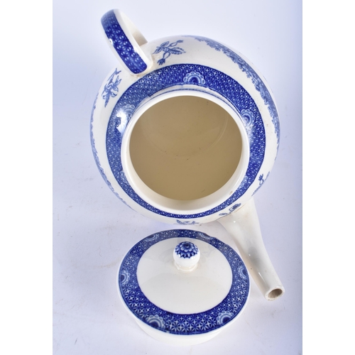 689 - A WEDGWOOD COMMEMORATIVE BLUE AND WHITE TEAPOT AND COVER together with a figural ceramic salt. Large... 