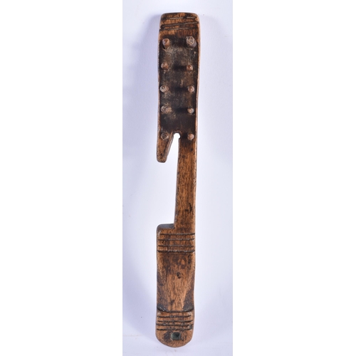 690 - AN EARLY TREEN LACE MAKERS WOODEN TOOL. 21 cm long.