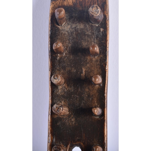 690 - AN EARLY TREEN LACE MAKERS WOODEN TOOL. 21 cm long.