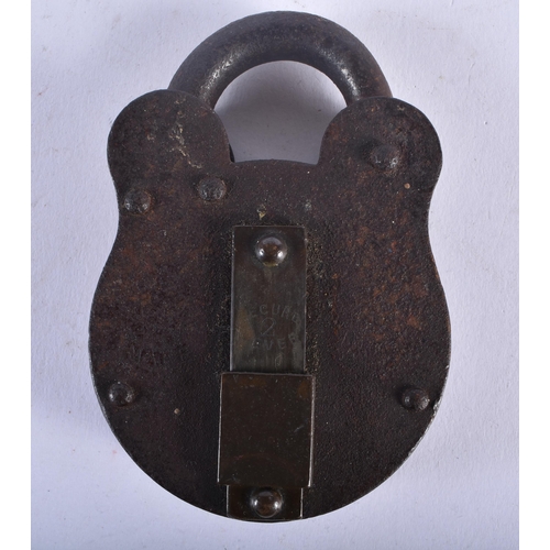 702 - A PAIR OF ANTIQUE HANDCUFFS together with a similar padlock. Largest 24 cm long. (3)