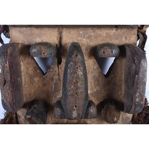 703 - A LARGE AFRICAN TRIBAL CARVED WOOD MASK. 54 cm x 28 cm.