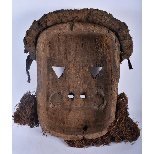 703 - A LARGE AFRICAN TRIBAL CARVED WOOD MASK. 54 cm x 28 cm.