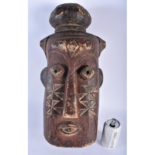 704 - A LARGE AFRICAN TRIBAL CARVED WOOD MASK. 48 cm x 18cm.