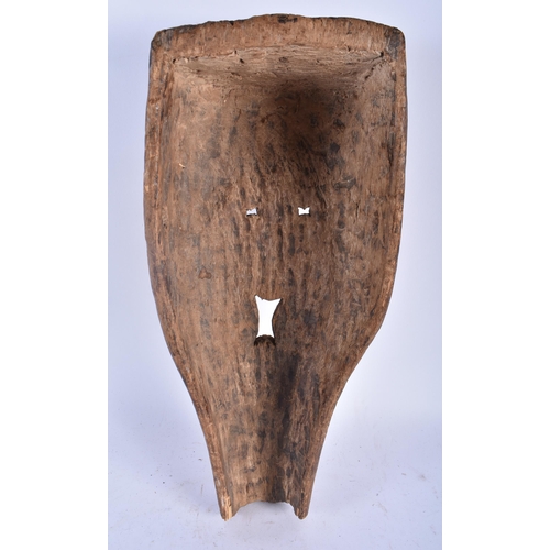 706 - A LARGE AFRICAN TRIBAL CARVED WOOD MASK. 45cm x 20 cm.