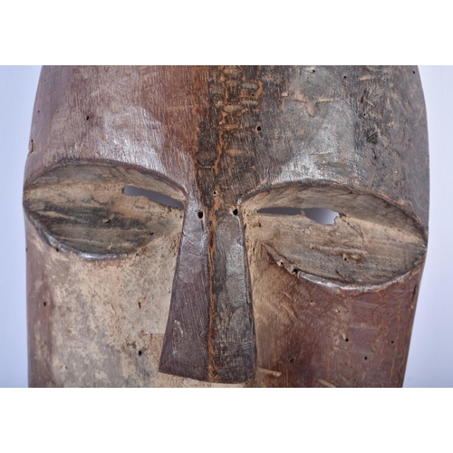 708 - AN AFRICAN TRIBAL CARVED WOOD MASK. 28 cm x 14 cm.