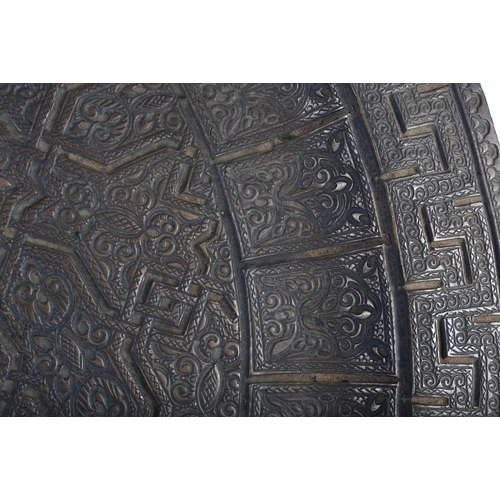 712 - AN UNUSUAL LARGE 18TH/19TH CENTURY MIDDLE EASTERN ISLAMIC BRONZE CHARGER decorated all over with geo... 