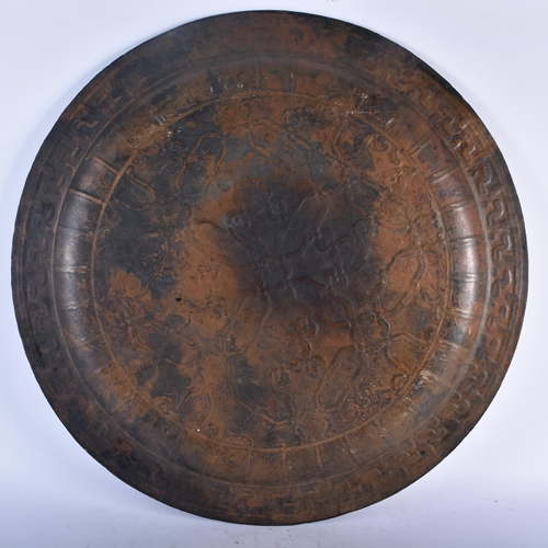 712 - AN UNUSUAL LARGE 18TH/19TH CENTURY MIDDLE EASTERN ISLAMIC BRONZE CHARGER decorated all over with geo... 