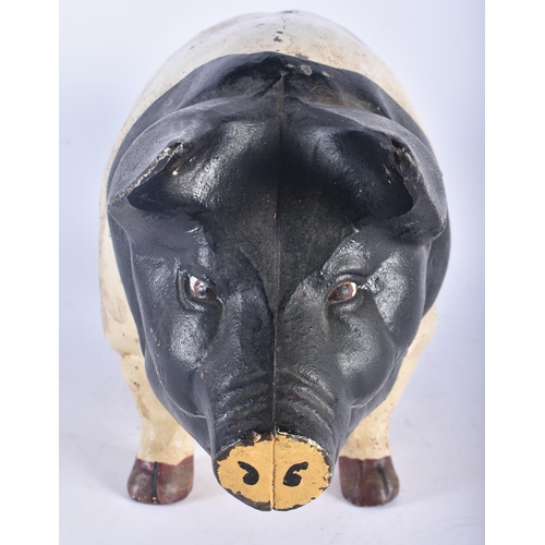 713 - A CHARMING LARGE COLD PAINTED CAST IRON FOLK ART PIG MONEY BOX. 45cm x 18cm.