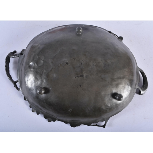 719 - AN ART NOUVEAU TWIN HANDLED PEWTER DISH together with a figural lamp. Largest 28cm high. (2)