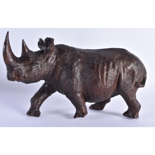 72 - A LARGE 19TH CENTURY ANGLO INDIAN CARVED EBONY FIGURE together with an African hardwood rhinoceros. ... 