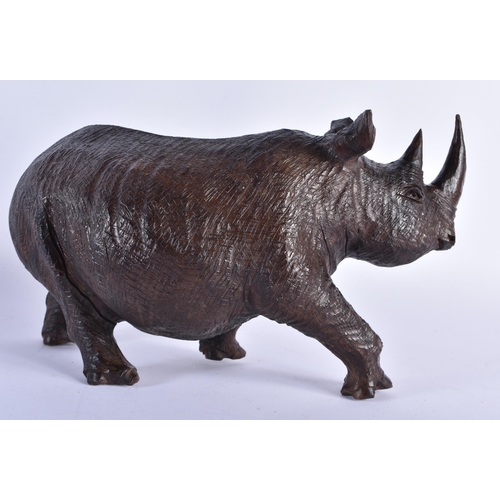 72 - A LARGE 19TH CENTURY ANGLO INDIAN CARVED EBONY FIGURE together with an African hardwood rhinoceros. ... 