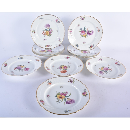 721 - A SET OF TEN DANISH ROYAL COPENHAGEN PORCELAIN SCALLOPED DISHES painted with flowers. 21 cm wide. (1... 