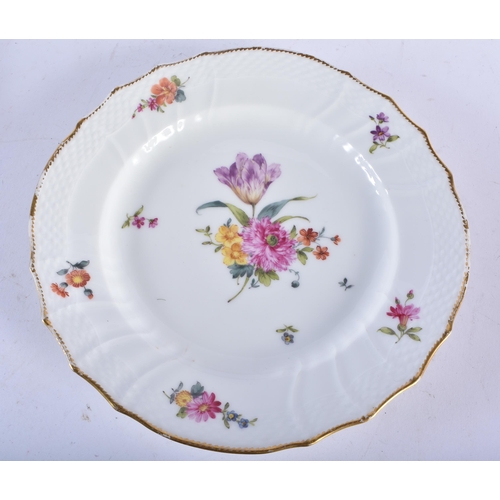 721 - A SET OF TEN DANISH ROYAL COPENHAGEN PORCELAIN SCALLOPED DISHES painted with flowers. 21 cm wide. (1... 