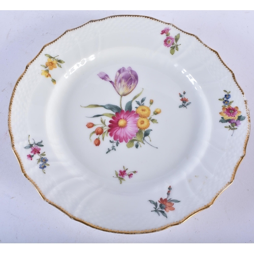 721 - A SET OF TEN DANISH ROYAL COPENHAGEN PORCELAIN SCALLOPED DISHES painted with flowers. 21 cm wide. (1... 