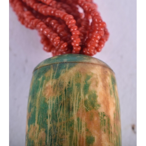 724 - A CORAL NECKLACE together with a malachite necklace & another. Largest 56 cm long. (3)