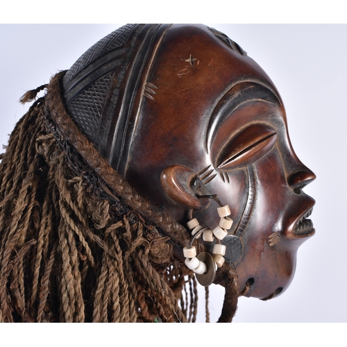 73 - A LARGE EARLY 20TH CENTURY AFRICAN TRIBAL WOOD MASK with later stand. 48 cm x 15 cm.