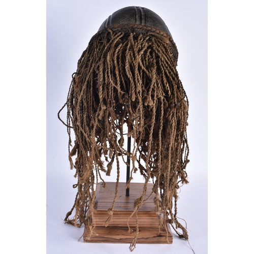 73 - A LARGE EARLY 20TH CENTURY AFRICAN TRIBAL WOOD MASK with later stand. 48 cm x 15 cm.