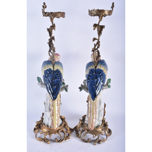 730 - A LARGE PAIR OF CONTINENTAL PORCELAIN ORMOLU AND BRONZE PARROT CANDLESTICKS. 56 cm high.