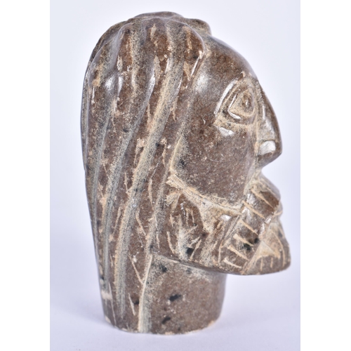 733 - A 19TH CENTURY MIDDLE EASTERN CARVED STONE HEAD OF A SAINT. 8 cm x 3.5 cm.