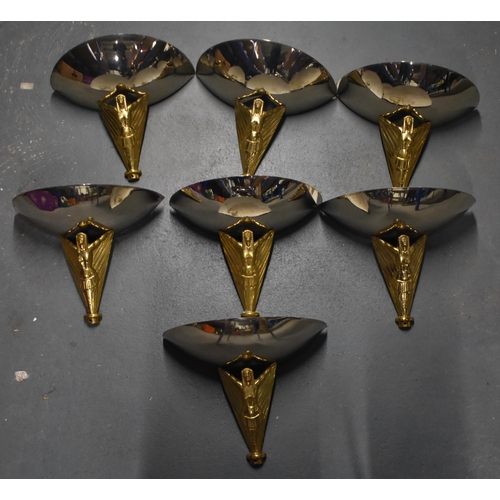 737 - A SET OF SEVEN ART DECO STYLE BRASS AND CHROME UPLIGHTERS formed as winged females. 34 cm x 38 cm. (... 