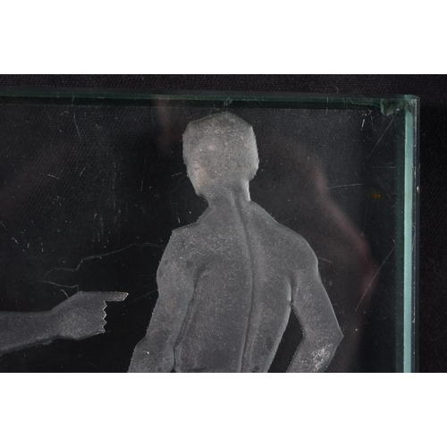 738 - AN ART DECO GLASS WALL INSET TILE depicting two nudes. 15 cm square.