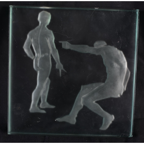 738 - AN ART DECO GLASS WALL INSET TILE depicting two nudes. 15 cm square.