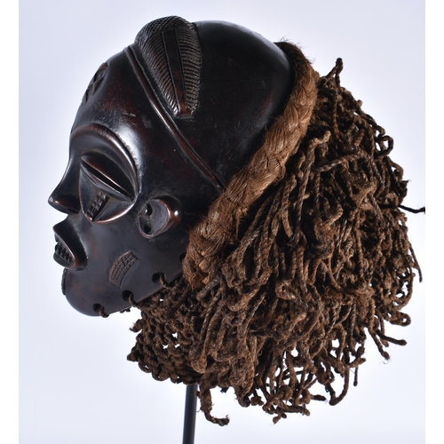 74 - A LARGE EARLY 20TH CENTURY AFRICAN TRIBAL WOOD MASK with later stand. 58 cm x 14 cm.