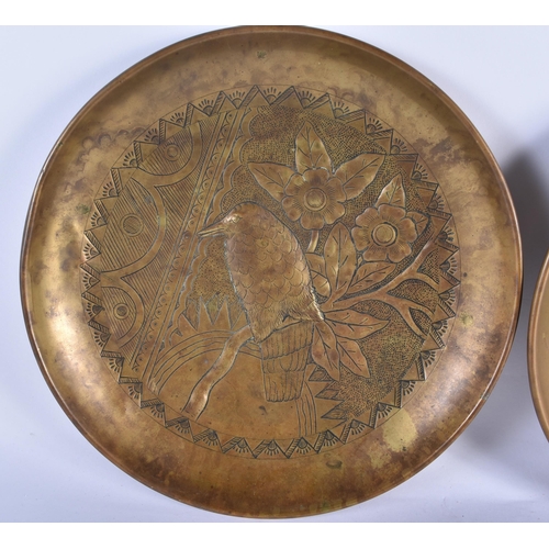 750 - A LARGE PAIR OF ARTS AND CRAFTS BRASS REPOUSSE DISHES depicting carp and birds amongst foliage. 30cm... 