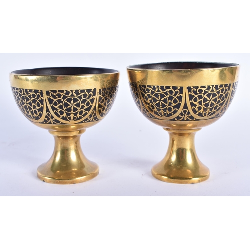 760 - A PAIR OF 19TH CENTURY ANGLO INDIAN BRONZE OVERLAID CARVED COCONUT CUPS decorated with motifs. 8 cm ... 