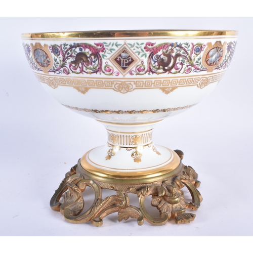 762 - A LATE 19TH CENTURY FRENCH SEVRES PORCELAIN COMPORT painted with foliage and motifs, upon a fitted g... 