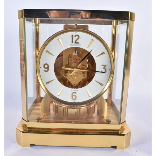 764 - A JAEGER LE COULTRE BRASS ATMOS CLOCK together with a smaller Cornish stone desk barometer. Largest ... 