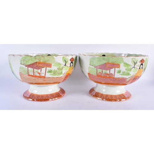 766 - AN UNUSUAL PAIR OF 19TH CENTURY POTTERY ORANGE LUSTRE BOWLS printed and painted with possible South ... 