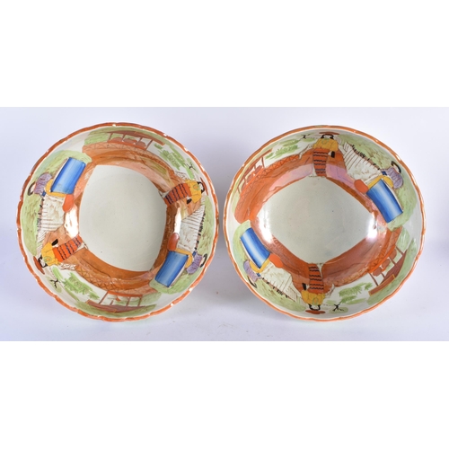 766 - AN UNUSUAL PAIR OF 19TH CENTURY POTTERY ORANGE LUSTRE BOWLS printed and painted with possible South ... 