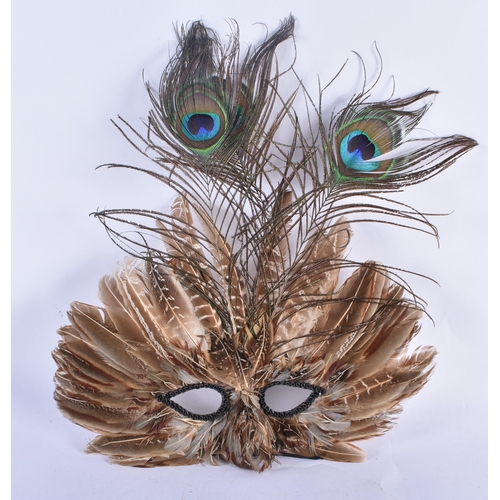 769 - A VINTAGE PEACOCK FEATHER VENETIAN STYLE THEATRICAL MASK. 34 cm x 27 cm.