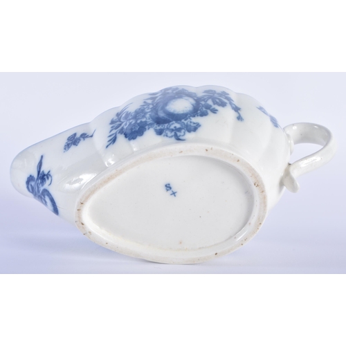 77 - AN 18TH CENTURY CAUGHLEY BLUE AND WHITE PORCELAIN SAUCE BOAT decorated with fruiting vines upon a ri... 