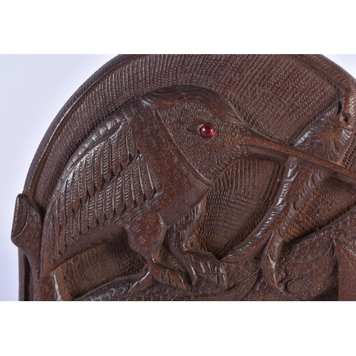 771 - A PAIR OF EARLY 20TH CENTURY ANGLO INDIAN BURMESE CARVED WOOD BIRD BOOKENDS. Each 15 cm x 18cm open.