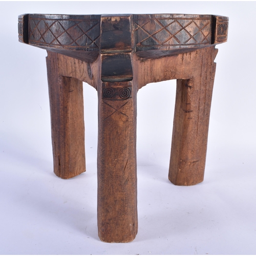 777 - AN AFRICAN TRIBAL CARVED WOOD STOOL. 27 cm x 27 cm.