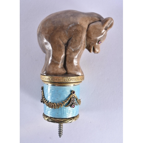 788 - A CONTINENTAL SILVER GILT ENAMEL RUBY AND HARDSTONE BEAR WALKING CANE HANDLE. 205 grams. 9 cm x 6 cm... 