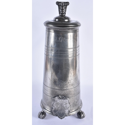 809 - A LARGE ANTIQUE ARMORIAL PEWTER FLAGON bearing 1704 date to top. 48 cm high.