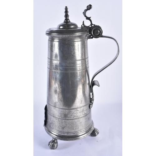 809 - A LARGE ANTIQUE ARMORIAL PEWTER FLAGON bearing 1704 date to top. 48 cm high.