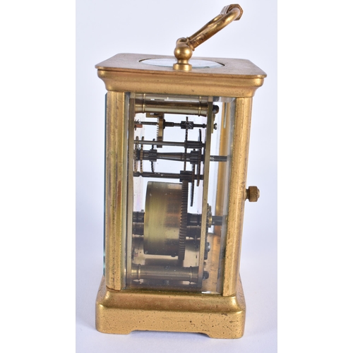 813 - A FRENCH BRASS CARRIAGE CLOCK. 13.5 cm high inc handle.