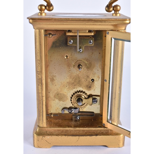 813 - A FRENCH BRASS CARRIAGE CLOCK. 13.5 cm high inc handle.