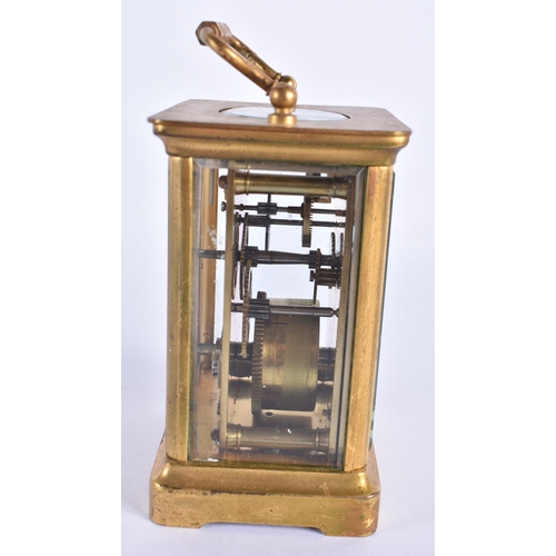 813 - A FRENCH BRASS CARRIAGE CLOCK. 13.5 cm high inc handle.