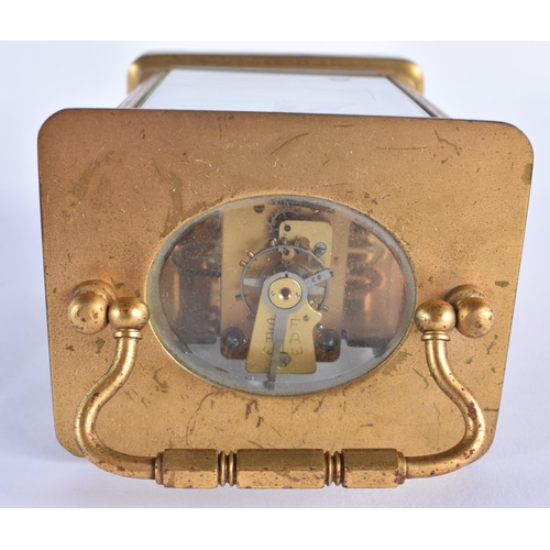 813 - A FRENCH BRASS CARRIAGE CLOCK. 13.5 cm high inc handle.