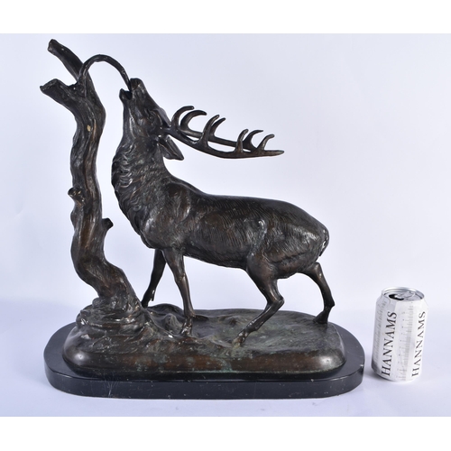 831 - A LARGE BRONZE AND MARBLE FIGURE OF A STAG modelled beside a tree stump. 44 cm x 36 cm.