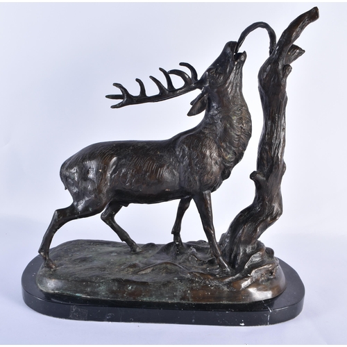 831 - A LARGE BRONZE AND MARBLE FIGURE OF A STAG modelled beside a tree stump. 44 cm x 36 cm.