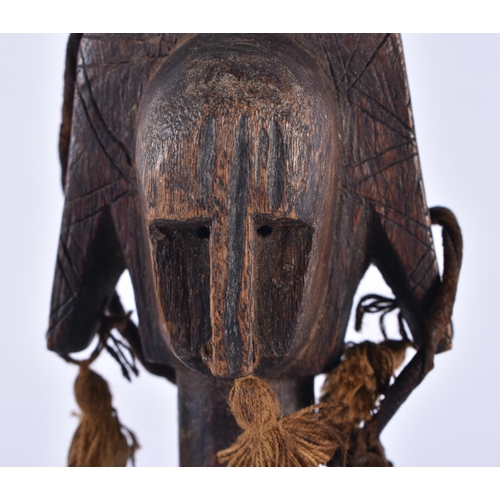 832 - A TRIBAL CARVED WOOD AFRICAN PULLEY. 24 cm high.