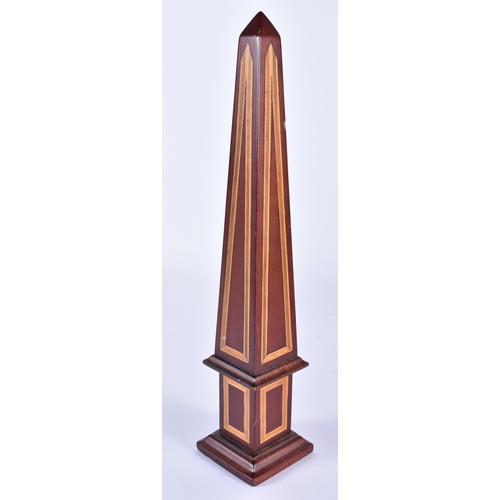 833 - A GEORGE III STYLE MAHOGANY OBELISK. 30cm high.