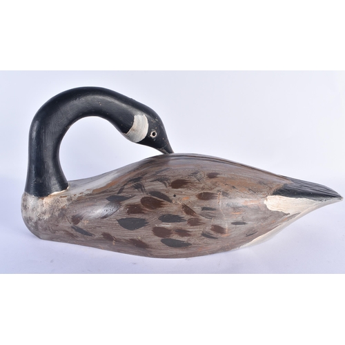 837 - A LARGE CANADIAN GOOSE FOLK ART PAINTED WOOD DECOY. 44 cm x 20 cm.