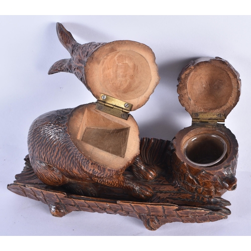 838 - A 19TH CENTURY BAVARIAN BLACK FOREST CARVED WOOD INKWELL formed as a seated rabbit beside a well. 18... 